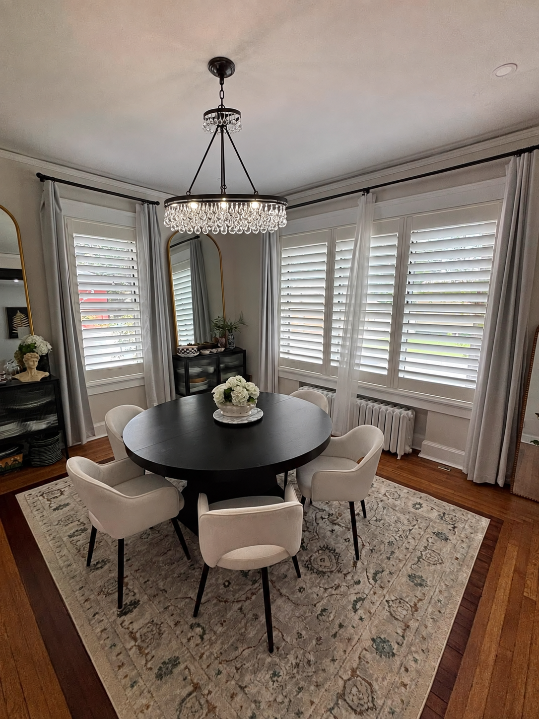 White shutters and drapery in a dining room