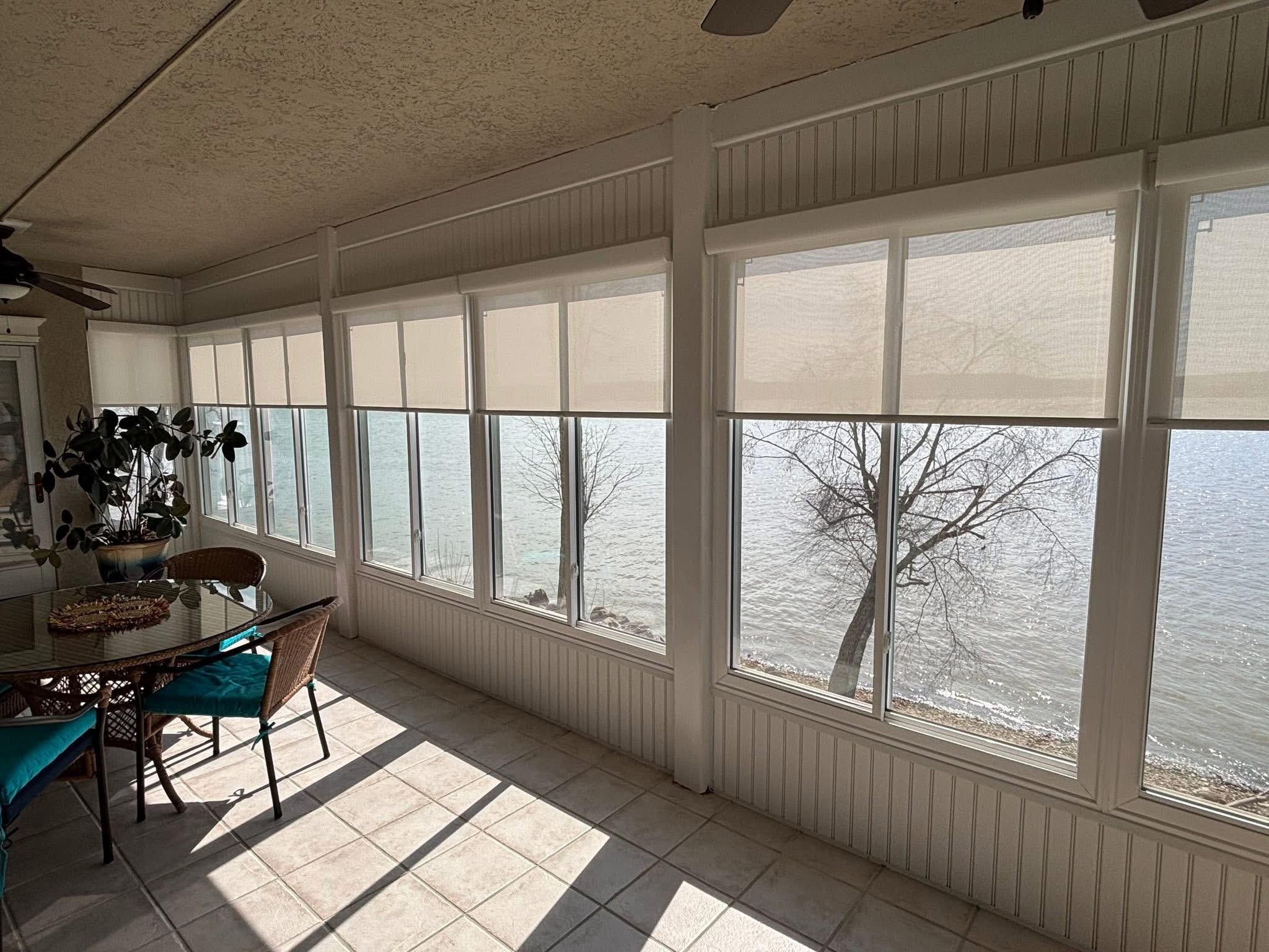 Shades across a lakefront sunroom
